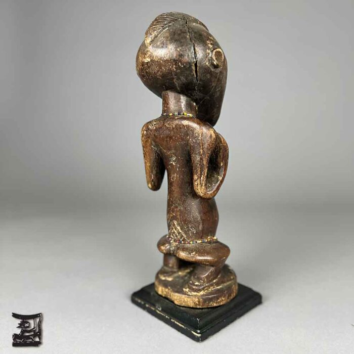 Marvel at this intricate Luba Female Figure carving that embodies their reverence for motherhood and exquisite craftsmanship.